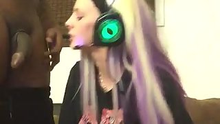 Blonde amateur girl sucks a ebony cock while playing vid games