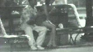 Couple in park after club having hookup in public on a bench