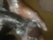 Soaping up my black cock for the camera while taking a shower